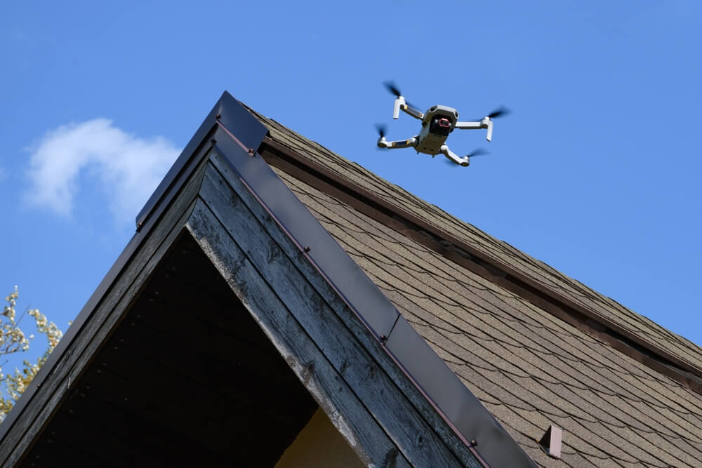 drone inspecting a residential roof